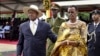 FILE - Uganda's longtime president Yoweri Museveni, 71, left, and his wife Janet Museveni, right, attend his last inauguration ceremony in the capital Kampala, May 12, 2016. 