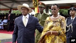 FILE - Uganda's longtime president Yoweri Museveni, 71, left, and his wife Janet Museveni, right, attend his last inauguration ceremony in the capital Kampala, May 12, 2016. 