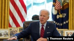 FILE PHOTO: U.S. President Biden signs executive orders on access to affordable healthcare in Washington