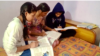 Pooja Sharma (in white shirt on left) and her two sisters missed many online classes because they had to share the phone with their brother. (Suhasini Sood/VOA)