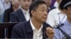 In this image taken from video, Chinese politician Bo Xilai looks up in a court room at Jinan Intermediate People's Court in Jinan, eastern China's Shandong province, Aug. 26, 2013.