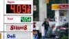 FILE - A driver fills a tank at a gas station in Marysville, Washington, Dec. 10, 2021. Consumer prices rose 6.8% for the 12 months ending in November, a 39-year high.