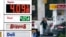 FILE - A driver fills a tank at a gas station in Marysville, Washington, Dec. 10, 2021. Consumer prices rose 6.8% for the 12 months ending in November, a 39-year high.