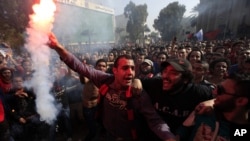 Egyptian soccer fans of Al-Ahly club celebrate a court verdict that returned 21 death penalties in last years soccer violence, which left 74 dead, inside the club premises in Cairo, Egypt, January 26, 2013. 