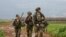 Israeli soldiers patrol an area near the northern kibbutz of Kfar Blum close to the border with Lebanon after Hezbollah said its fighters carried out an aerial attack with two drones against an Israeli air defense system site in the border region on Janua