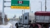 A commercial truck enters the entrance ramp to the Ambassador Bridge to Canada in Detroit, Michigan, Feb. 14, 2022.