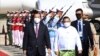 FILE - Cambodian Prime Minister Hun Sen, left, reviews an honor guard with Myanmar Foreign Minister Wunna Maung Lwin, front right, on his arrival at Naypyitaw International Airport in Naypyitaw, Myanmar, on Jan 7, 2022. (An Khoun Sam Aun/National Television of Cambodia via AP)