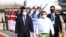 FILE - Cambodian Prime Minister Hun Sen, left, reviews an honor guard with Myanmar Foreign Minister Wunna Maung Lwin, front right, on his arrival at Naypyitaw International Airport in Naypyitaw, Myanmar, on Jan 7, 2022. (An Khoun Sam Aun/National Television of Cambodia via AP)