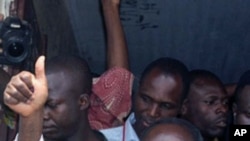 President Francois Bozize gives a thumbs up after voting on January 23, 2011