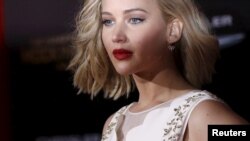 Cast member Jennifer Lawrence poses at the premiere of "The Hunger Games: Mockingjay - Part 2" in Los Angeles, California Nov. 16, 2015. 