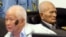 In this photo released by the Extraordinary Chambers in the Courts of Cambodia, Khieu Samphan, left, former Khmer Rouge head of state, and Nuon Chea, right, who was the Khmer Rouge's chief ideologist and No. 2 leader, sit in the court hall before they made closing statements at the U.N.-backed war crimes tribunal in Phnom Penh, file photo. 