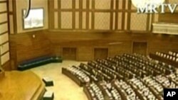 Chris Uche, left, lawyer of Iranian, Azim Aghajani, centre, and Nigerian, Usman, Abbas, right, speaks, as the waits for a court verdict at the Federal High Court, in Lagos, Monday, May 13, 2013.