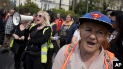 Municipal contract workers protest outside the Greek Parliament demanding their contract renewals, in Athens, March 27, 2018. Bailout creditors want Greece to continue with austerity measures after the rescue program ends in August, in exchange tor better repayment terms. On March 27, Europe's bailout fund approved a 6.7 billion- euro ($8.32 billion) loan installment to Greece.