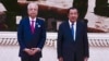 Cambodian Prime Minister Hun Sen, right, poses for photographs together with his Malaysian counterpart Ismail Sabri Yaakob, left, during his visit to Cambodia in Phnom Penh, Cambodia, Thursday, Feb. 24, 2022. (Kok Ky/Cambodia's Government Cabinet via AP)