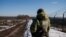 Ukrainian frontier guards patrol an area along the Ukrainian-Russian border in the Kharkiv region, Ukraine on Feb. 23, 2022.