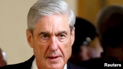 FILE - Special Counsel Robert Mueller departs after briefing members of the U.S. Senate on his investigation into potential collusion between Russia and the Trump campaign on Capitol Hill in Washington.
