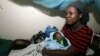 Josephine Ochieng holds her newborn baby boy at the Nyanza Provincial general, Kisumu, Kenya, November 2008.
