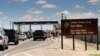FILE - This Sept. 9, 2014 file photo shows cars waiting to enter Fort Bliss in El Paso, Texas. The base is one of three Texas military properties to be considered as a shelter location for unaccompanied migrant children.