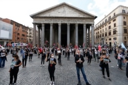 Tourists guides stage a protest in front of Rome's Pantheon, June 9, 2020, asking for government aid after months of travel restriction due to coronavirus.
