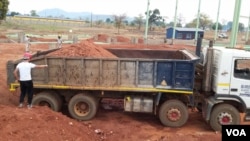 A ski jump staff member walks at empty stands during the second competition jump of the FIS Men&#39;s Ski Jumping World Cup in Willingen, western Germany, Jan. 30, 2021.