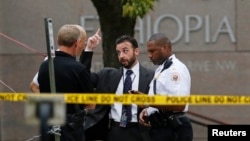 FILE - United States Secret Service police are seen standing in front of the Ethiopian Embassy in Washington Sept. 29, 2014, in connection with a shooting incident at the compound.