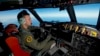 Royal Australian Air Force (RAAF) pilot, Flight Lieutenant Russell Adams from 10 Squadron, steers his AP-3C Orion over the Southern Indian Ocean during the search for missing Malaysian Airlines flight MH370, March 20, 2014.
