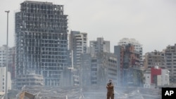 A soldier stands at the site of the explosion in the port of Beirut, Lebanon, Aug. 6, 2020. 