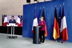 German Chancellor Angela Merkel holds a joint video news conference with French President Emmanuel Macron in Berlin, Germany, May 18, 2020.