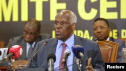 FILE - Angolan President Jose Eduardo dos Santos attends a party central committee meeting in Luanda, Dec. 2 ,2016. He is stepping down after 38 years in power.