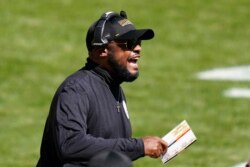 FILE - Pittsburgh Steelers head coach Mike Tomlin yells from the sideline during the first half of an NFL football game against the Denver Broncos, in Pittsburgh, Sept. 20, 2020.