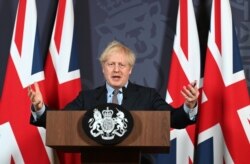 British Prime Minister Boris Johnson holds a news conference in Downing Street on the outcome of the Brexit negotiations, in London, Dec. 24, 2020.