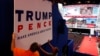 Workers place a sign as they prepare at Quicken Loans Arena for the Republican National Convention, Sunday, July 17, 2016.