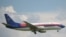Pesawat Sriwijaya Air Boeing 737-300, mirip dengan Boeing 737-500 SJY182 yang kehilangan kontak dalam penerbangan dari Jakarta ke Pontianak pada 9 Januari. 2021. (Foto: AFP/Adek Berry)