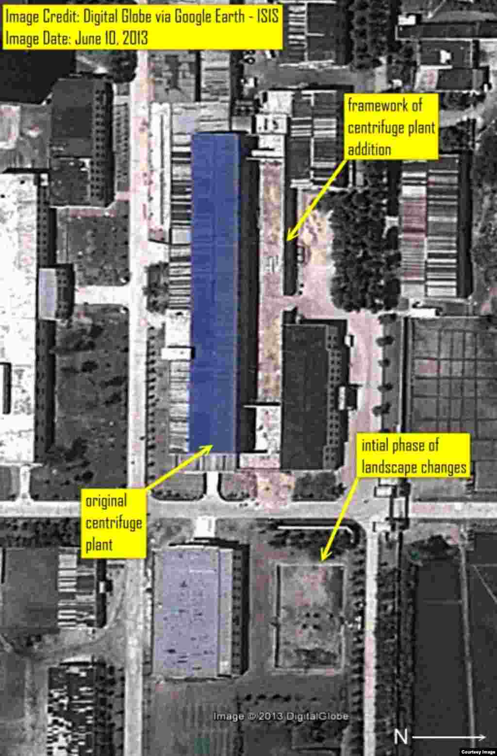 A couple surrounded by sunflowers kisses outside Schiphol Airport&#39;s passenger terminal in Amsterdam, the Netherlands.