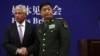 U.S. Secretary of Defense Chuck Hagel (L) shakes hands with Chinese Minister of Defense Chang Wanquan at Chinese Defense Ministry headquarters in Beijing April 8, 2014.