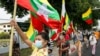Military supporters wave Myanmar national flags during a protest to demand an inquiry to investigate the Union Election Commission (UEC) in Yangon on January 29, 2021, as fears swirl about a possible coup by the military over electoral fraud…