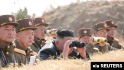 North Korean leader Kim Jong Un guides artillery fire competition in this image released by North Korea's Korean Central News Agency on March 20, 2020.
