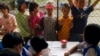 Stateless children in Thailand peer into the classroom of a school they are barred from attending. (Joseph Quinnell)
