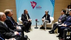 A Polish imam, right, and two other members of a Muslim community bury the tiny white casket of an unborn Iraqi boy, in Bohoniki, Poland.&nbsp;The child is the latest life claimed as thousands of migrants from the Middle East have sought to enter the European Union.