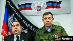 FILE - Alexander Zakharchenko, right, leader of the separatist-controlled area of Donetsk, and Igor Plotnitsky, leader of the separatist-controlled area of Luhansk, attend a news conference in Donetsk, Feb. 2, 2015.