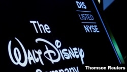 FILE - A screen shows the trading info for the Walt Disney Company company on the floor of the NYSE in New York in December 2017.