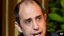 A Palestinian fisherman casts his net at a beach in Gaza City. Israel permits Gaza fishermen to head out to sea from 3 miles to 6 miles, restoring a limit it cut in half two months ago in response to rocket fire from the Palestinian enclave.