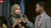 A moderator, right, and participant in the VOA Somali service's "Mogadishu-Minnesota" town hall meeting are seen in a screen grab from its Facebook stream.