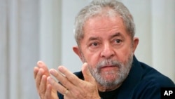 FILE - Brazil's former President Luiz Inacio Lula da Silva attends an extraordinary Worker's Party leaders meeting in Sao Paulo, Brazil, March 30, 2015. 