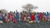 Displaced women gather to collect water from a water hole near Jamam refugee camp in South Sudan's Upper Nile State, March 10, 2012.