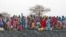 Displaced women gather to collect water from a water hole near Jamam refugee camp in South Sudan's Upper Nile State, March 10, 2012.