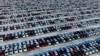 New cars are seen at a parking lot in Shenyang, Liaoning province, China, Jan. 16, 2017. 