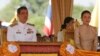 FILE - Thailand's Crown Prince Maha Vajiralongkorn (L) and Royal Consort Princess Srirasmi watch the royal plowing ceremony in Bangkok.