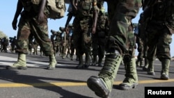  Les membres de la Brigade en attente de l'Afrique de l'Est de l'Ouganda.