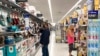 FILE - Consumers shop at a Walmart store in Vernon Hills, Ill., May 23, 2021. 